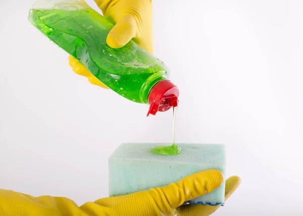 Dishwashing detergent pouring on sponge — Stock Photo, Image