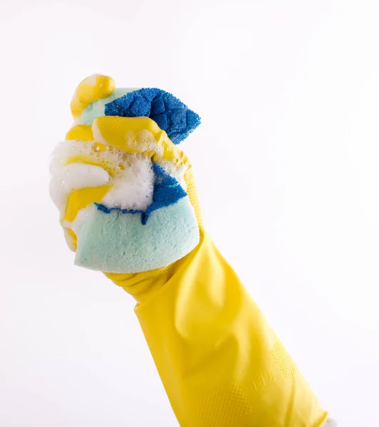 Hand med handskar klämma svamp — Stockfoto