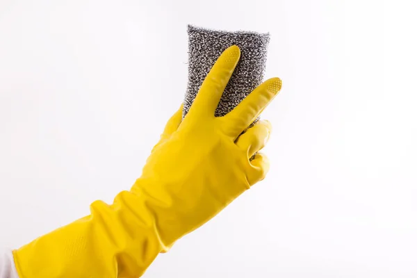 Mano con guanti tenendo spugna scrubber — Foto Stock