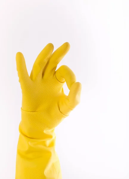 Ręka z rękawic pokazuje gest ok — Zdjęcie stockowe