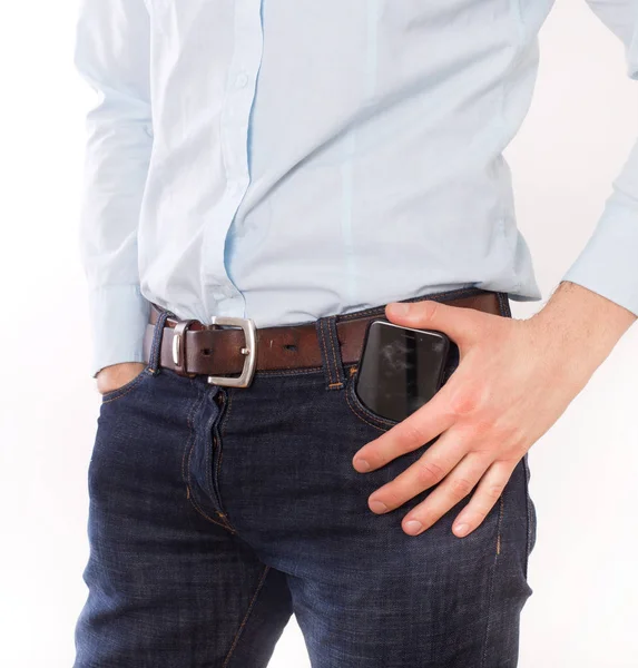 Man putting phone in pocket — Stock Photo, Image