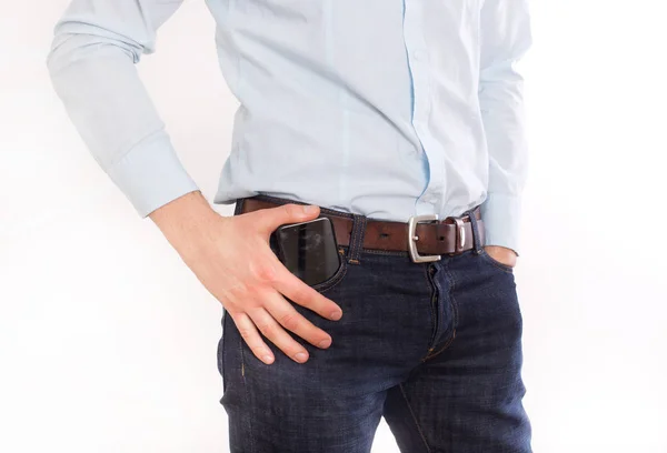 Man putting phone in pocket — Stock Photo, Image