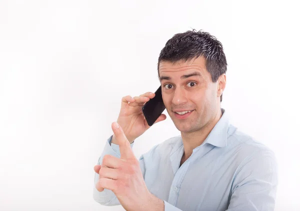 Homme avec téléphone portable montrant doigt vers le haut — Photo