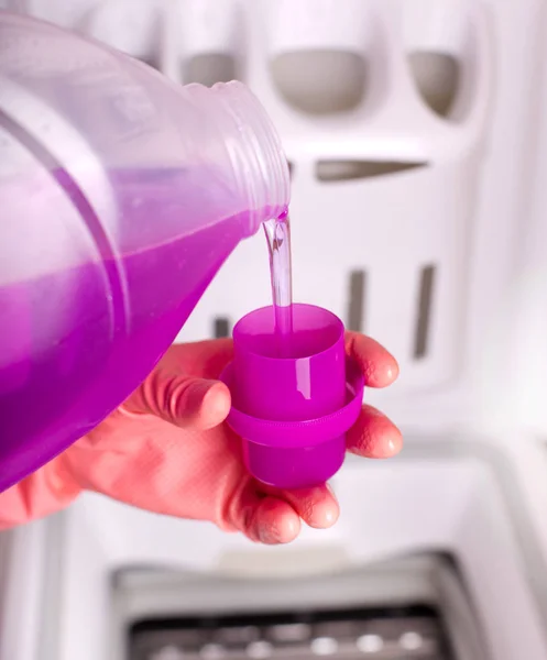 Pouring detergent for washing machine — Stock Photo, Image