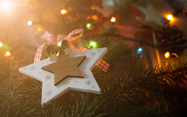 Christmas decoration star on fir tree — Stock Photo, Image