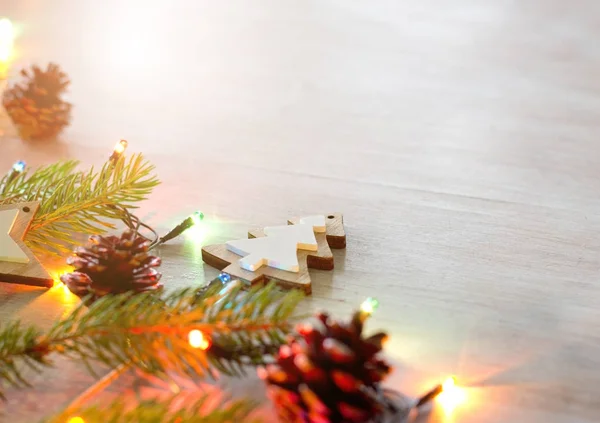 Christmas decoration and lights on table — Stock Photo, Image