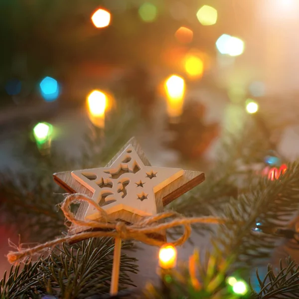 Christmas decoration star on fir tree — Stock Photo, Image