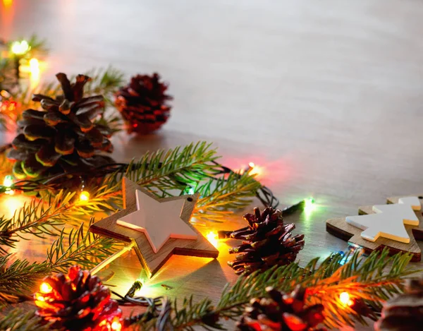 Christmas decoration and lights on table — Stock Photo, Image