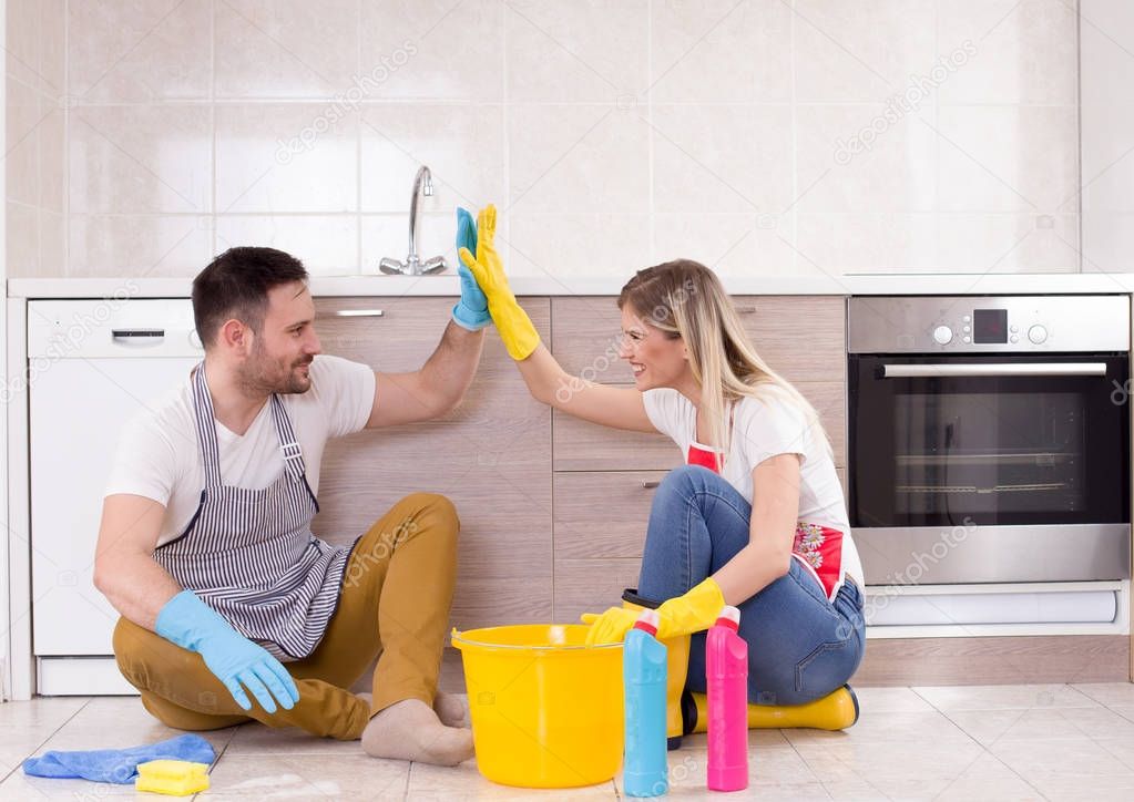 Man and woman happy about finishing chores