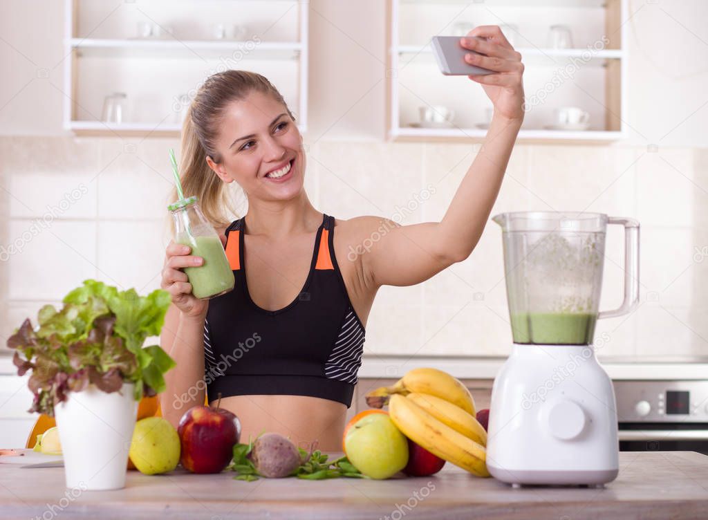 Girl taking selfie with fresh smoothie