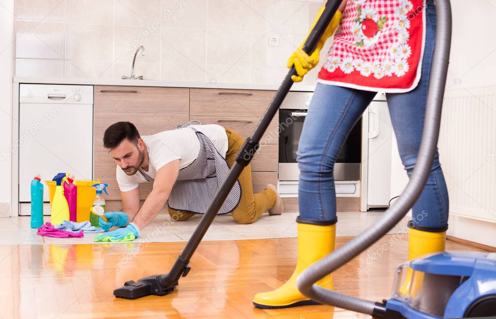 Young couple doing housework together