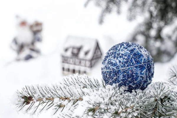 Christmas ornament on tree with snow — Stock Photo, Image