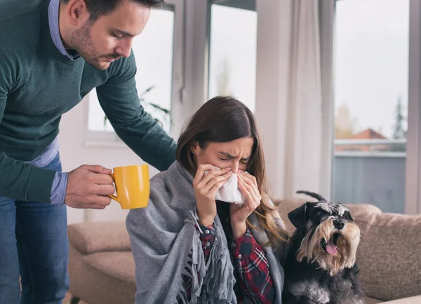 Boyfriend Bringing Tea Taking Care Girl Having Flu Sitting Sofa — Stock Photo, Image