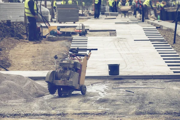 Team work on placement of the brick pavers 3 — Stock Photo, Image