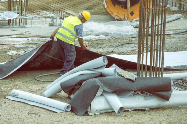 Insulation worker preparing bituminous waterproof membrane 3 — Stock Photo, Image