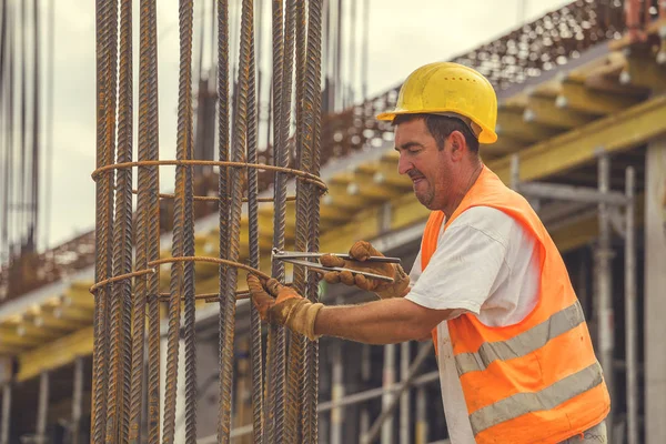 Tying reinforcing steel bars with plier and wire 5 — Stock Photo, Image