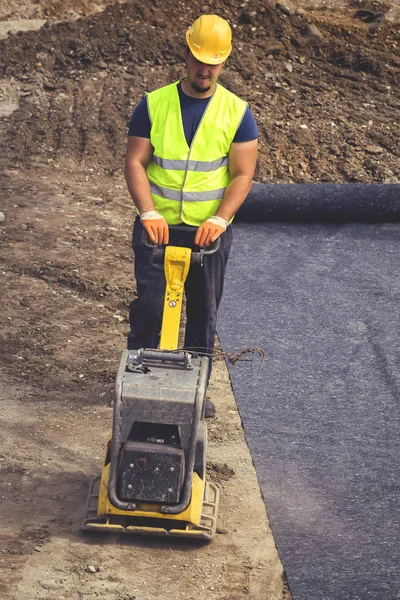 Worker with vibrating plate compactor 5 — Stock Photo, Image
