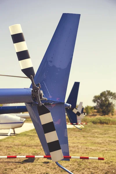 Row of tail rotors of Robinson helicopters 2 — Stock Photo, Image