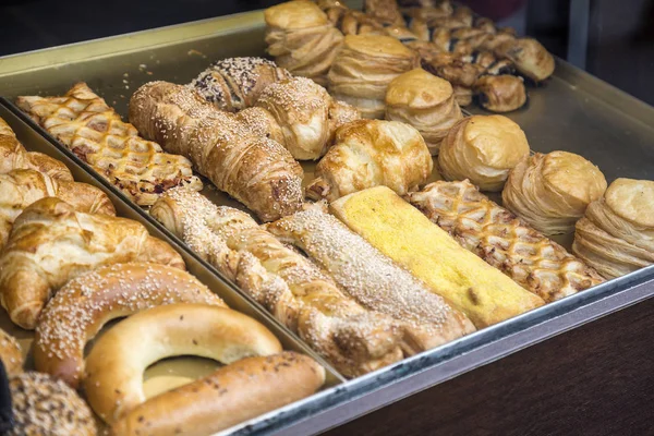 Pastries and variety of baked goods in a bakery — Stock Photo, Image