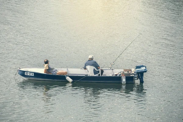 Two man fishing in a boat — Stock Photo, Image