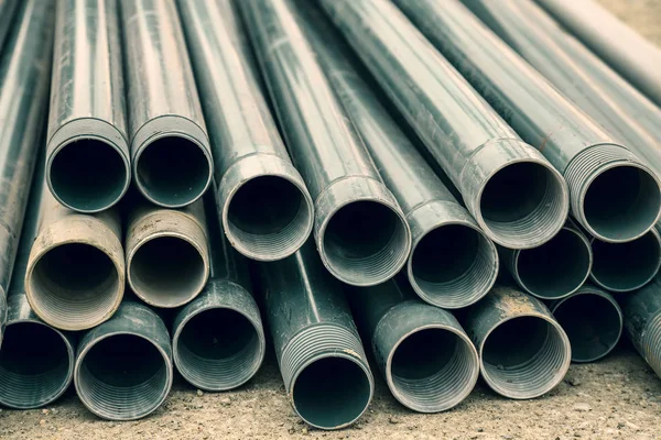 Pile of plastic pipes for water well drilling — Stock Photo, Image