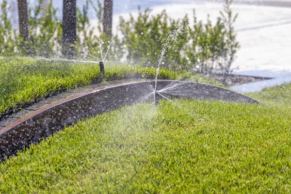 Sprinkler system, watering park lawn — Stock Photo, Image