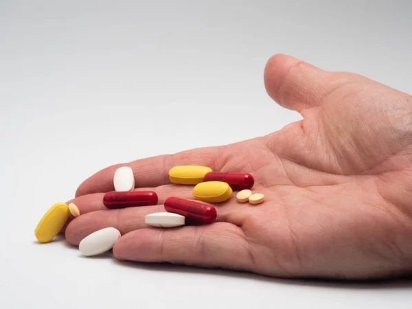Hand Holding Handful Colored Pills — Stock Photo, Image
