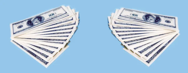 A stack of loose paper dollars in blue background. The concept of investment business, maintaining financial stability in a crisis, sports betting, totalizator. Copy-space.