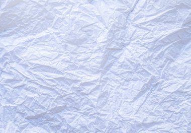 Buruşuk beyaz kağıt arkaplan arkaplanının düz, yakın çekim dokusu. Metin için boş alan kopyasıyla desenlerin dokusunu detaylandır.