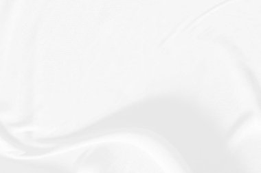 Beyaz kumaş arka plan soyut. Kumaş kırışık ve dalgalanıyor. Malzemeler tekstil montajında kullanılır. Desen tasarımının ayrıntılı dokusu, arkaplan veya duvar kağıdı için boş alan kopyası olan zarafet.