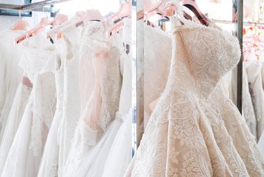 Arka planda güzel, beyaz gelinlik dokusu. Düğün elbiseleri, gelinlik salonunun iç tarafındaki askıda asılı. Tasarım, moda modern lüks detaylarıyla.
