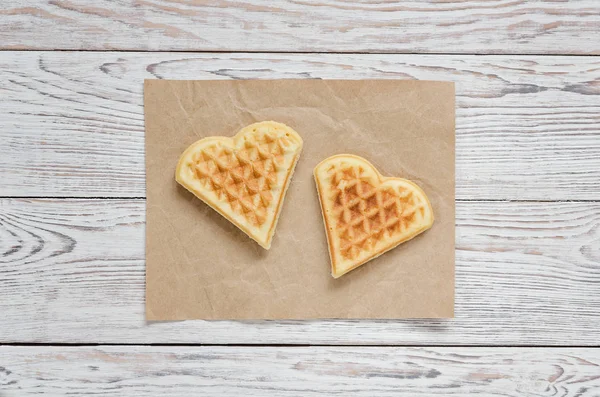 Two cookie hearts on crumpled paper — Stock Photo, Image
