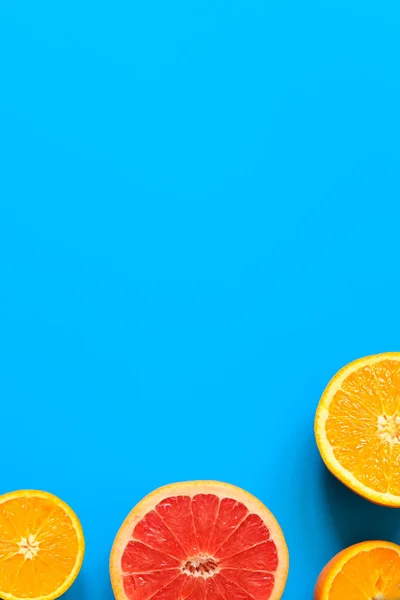 Citrus fruits top view border background.