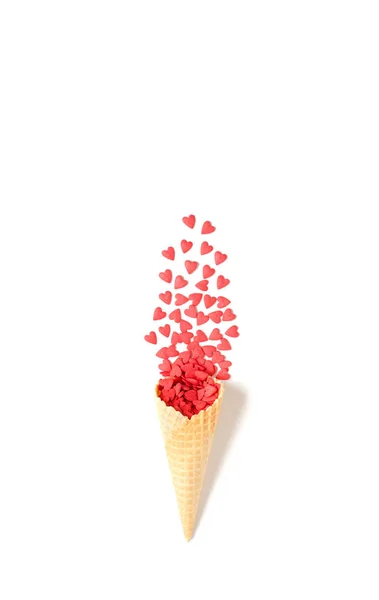 Waffle cone with red hearts. Valentine's day background — 스톡 사진