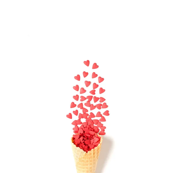 Waffle cone with red hearts. Valentine's day background — 스톡 사진