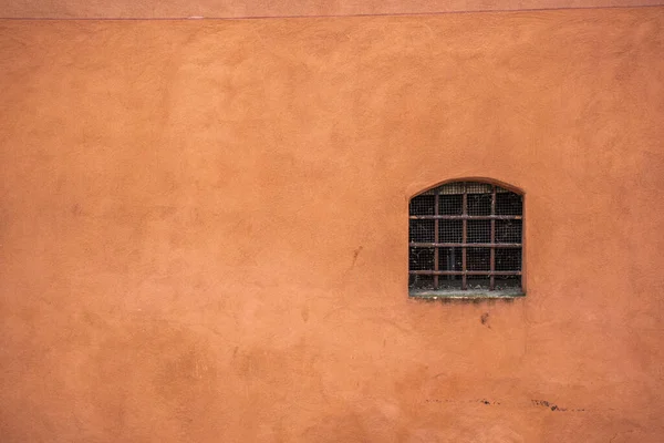 ocher wall with window