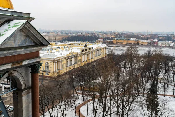 St. Petersburg, Russia, February 2020. Angels of St. Isaac`s Cathedral and a view of the city.