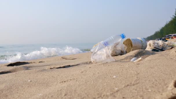 4K Plastic pollution garbage trash on beach. — Stock Video
