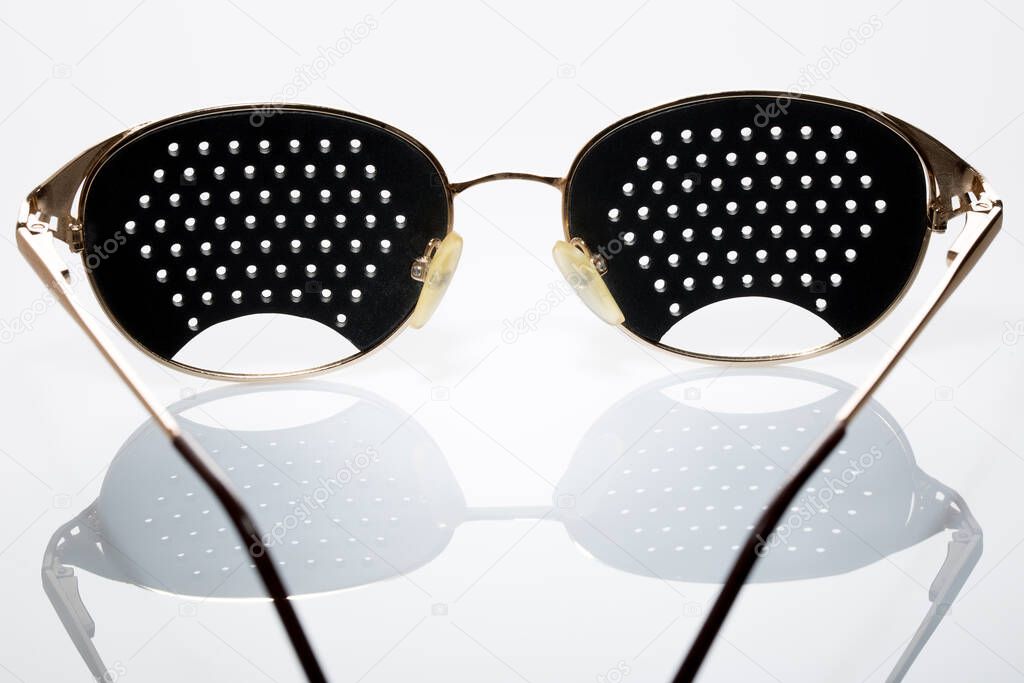 corrective glasses for people with astigmatism, glasses on a white background