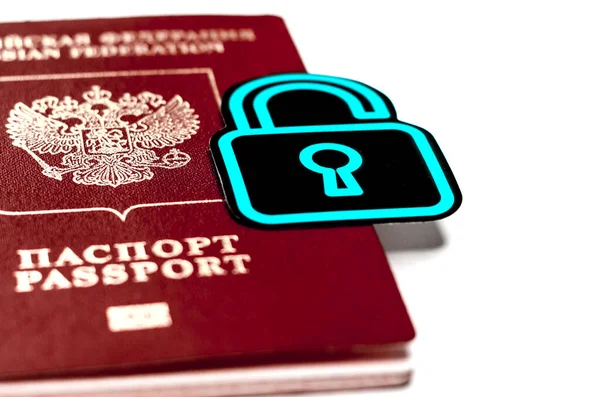Passport with a lock. Symbol of the prohibition of departure abroad due to the coronavirus pandemic. Refusal of a visa. Travel ban