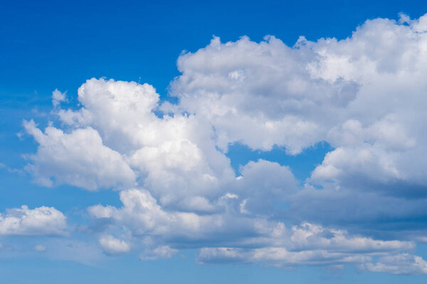 blue sky with clouds. blue sky background with tiny clouds