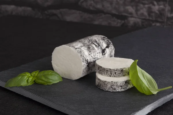 Goat cheese with basil on minimalistic plate — Stock Photo, Image