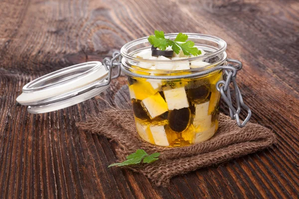 Preserved cheese in oil. Royalty Free Stock Photos