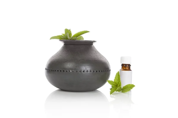 Aroma lamp with mint essential oil. — Stock Photo, Image