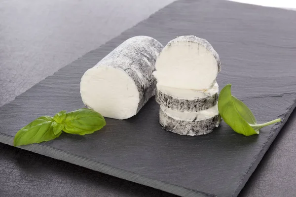 Goat cheese with basil — Stock Photo, Image