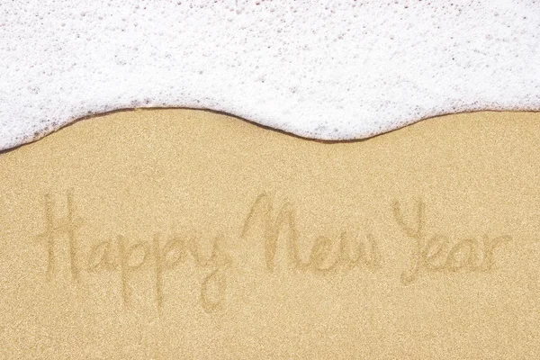 Bonne année écrite en sable sur la plage . — Photo