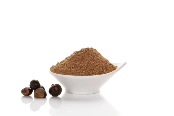 Guarana seeds and powder in bowl. — Stock Photo, Image