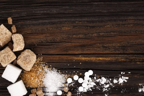 Los tipos distintos del azúcar de arriba sobre la mesa de madera —  Fotos de Stock
