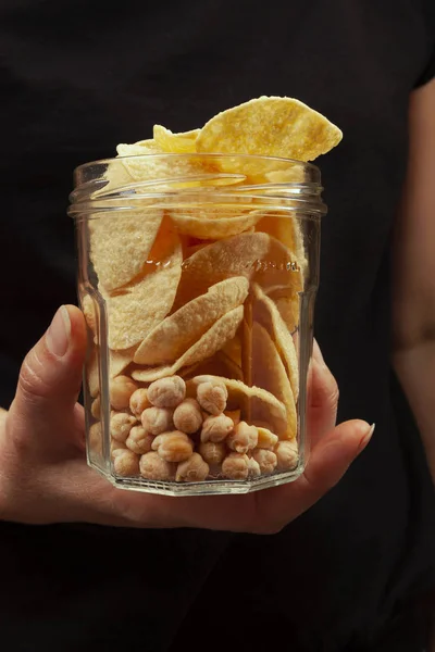 Chickpea chips and whole chickpea in glass pot. — Stock Photo, Image