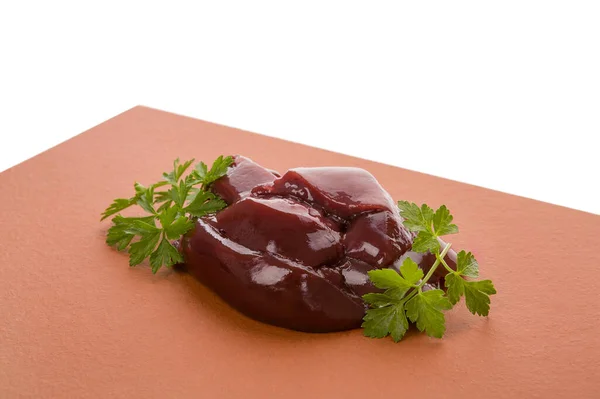 Turuncu Arka Planda Çiğ Tavuk Ciğeri Maydanozla Süslenmiş Yiyecek Malzemesi — Stok fotoğraf